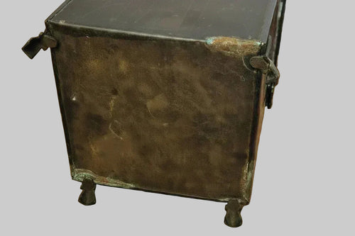 Close up of base of Antique Art Deco Copper Plated Coal Scuttle Genuine Patina showing wear and patina on plain background