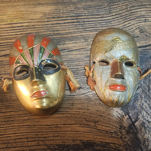 A duality of Mid-Century Solid Brass 'Elements' Masquerade Wall Masks