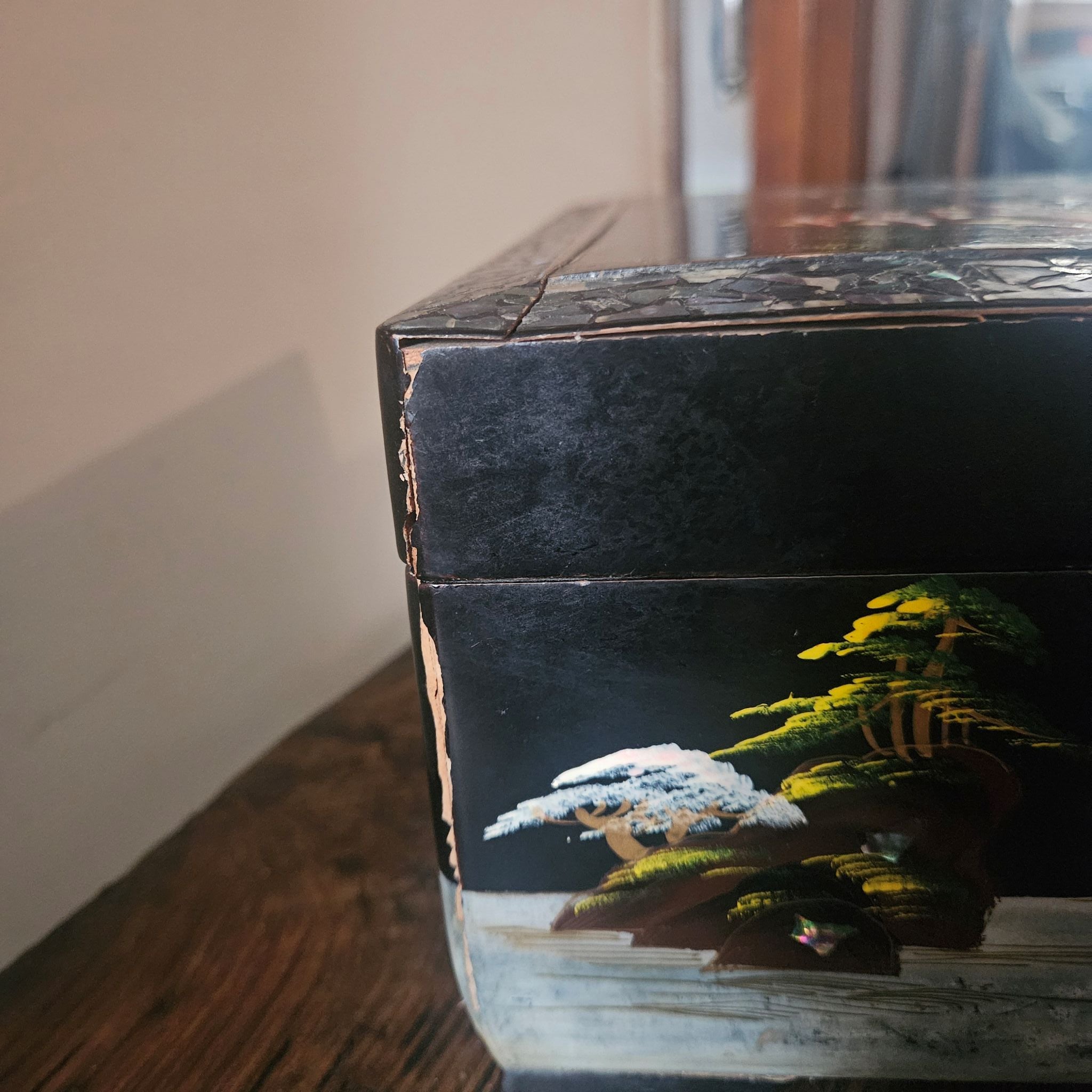 Side view of Mid Century Vintage Japanese Lacquer Wooden Cantilever Jewellery Box showing cracking lacquer